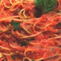 Capellini Pomodoro · Angelhair pasta tossed with a tomato and fresh basil sauce.