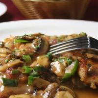 Scaloppine Di Vitello Al Marsala · Milk-fed veal scaloppine topped with a forest mushroom and marsala wine sauce, served with p...