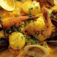 Risotto Ai Frutti Di Mare · Risotto simmered with shrimp, mussels, sea scallops, baby clams, fish broth and saffron with...