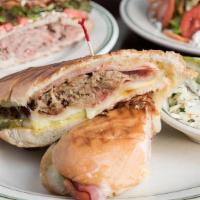 Cubano · mojo marinated slow roasted pulled pork, baked ham, swiss cheese,sliced dill pickle, yellow-...
