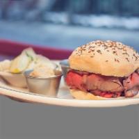 Beef On Weck · house roasted beef, extra hot horseradish, real au jus on a kimmelweck bun (warm and thin, s...