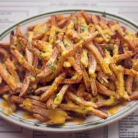 Hell Fries · our hand cut fries tossed in a dry chili rub and topped with our famous Inner Beauty Hot Sau...
