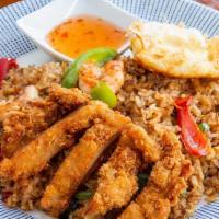 Indonesian Fried Rice
  · Jasmine rice wok-fried in sweet chili paste, crispy chicken, shrimp, bell peppers, onions an...