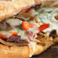 Pizza Steak Sub · A pizza style sub with a tender slice of steak. Choose as many toppings as you like!
