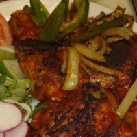1/2 Pollo Ala Parrilla · Grilled chicken marinated with huajiyo chili sauce as well as onion and whipped jalapeño pep...