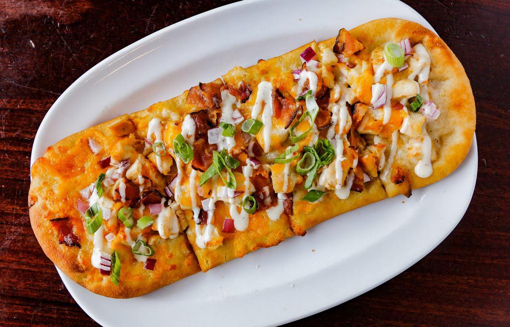 Chicken Bacon Ranch Flatbread · Grilled chicken, chopped bacon, blended cheddar cheese, chopped red onion & scallions with a ranch drizzle