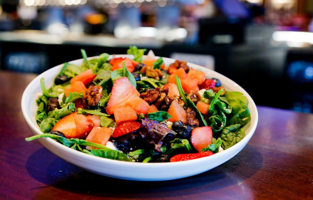 Fresh Fruit & Goat Cheese Salad · Fresh baby spinach & field greens mix, strawberries, watermelon & blueberries with crumbled goat cheese, candied walnuts and your choice of dressing