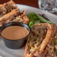 Steak & Cheese Egg Rolls · Hand rolled, shaved rib-eye steak, Monterey jack, peppers, onions, chipotle ranch.