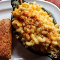 Traditional Mac & Cheese · Creamy, cheesy, delicious tossed with cavatappi pasta, baked with romano panko crumbs & serv...