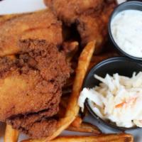 New England Style Fish & Chips · Atlantic haddock, french fries, cole slaw and tartar sauce