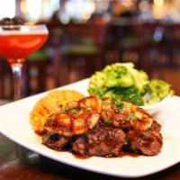 Teriyaki Steak Tips · 14 oz., 24 hour house marinade and your choice of two sides.