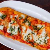 Margarita Flatbread · San marzano plum tomatoes, fresh mozzarella topped with basil & pecorino romano cheese with ...