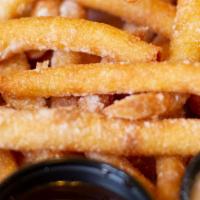 Funnel Cake Fries · All you love about Carnival Funnel cakes in french fry form, dusted with powdered sugar & ch...