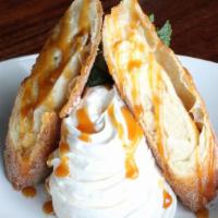 Banana Caramel Burrito · Creamy cheesecake layered with chunks of banana wrapped in a flaky pastry tortilla, cinnamon...