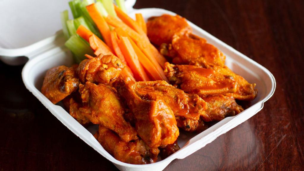 Bone-In Or Boneless Wings - Fm Style · 20 Pieces with your choice of one sauce. Served with carrot & celery sticks and your choice of ranch or blue cheese