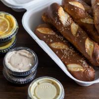 Bavarian Pretzel Sticks - Fm Style · 8 Pieces with whipped maple butter, creamy honey mustard & queso
