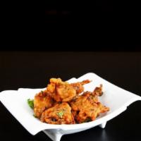 Vegetable Pakora · Vegetarian, gluten free. Singh's fritters are made with fresh onion and potato mixed with sp...