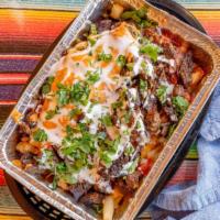 Carne Asada Fries · Fries with melted cheese on top. Topped with pico de gallo, red salsa, sour cream, chipotle ...