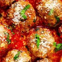 Homemade Meatballs · Meatballs in a marinara sauce.
