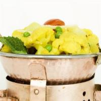 Aloo Gobi · Fresh cauliflower, potatoes & green peas delicately spiced. ( V, Veg, GF, NF). Served with B...