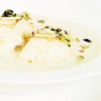 Ras Malai · Fresh homemade cheese patties cooked in milk syrup with almond and nuts.