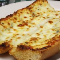Garlic Bread Parmigiana · Freshly baked Italian bread, seasoned with garlic, then topped with a blend of Italian chees...