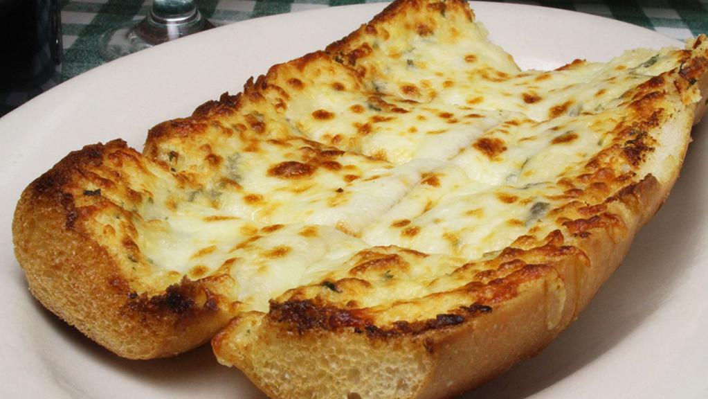 Garlic Bread Parmigiana · Freshly baked Italian bread, seasoned with garlic, then topped with a blend of Italian cheeses.