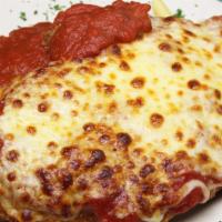 Chicken Parmigiana · A breaded chicken cutlet blanketed with our own marinara sauce and topped with a blend of It...