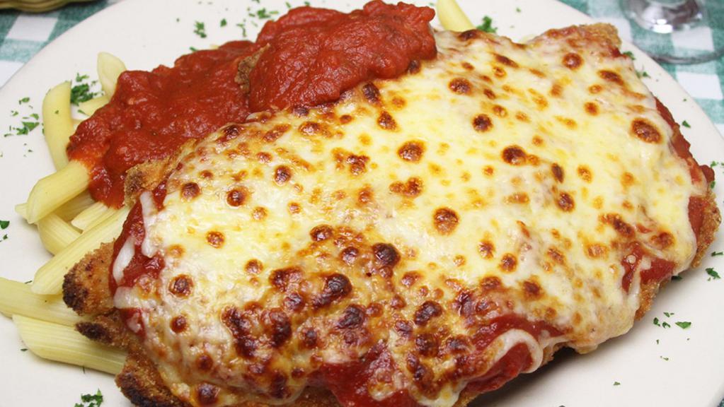 Chicken Parmigiana · A breaded chicken cutlet blanketed with our own marinara sauce and topped with a blend of Italian cheeses. Served with linguini.