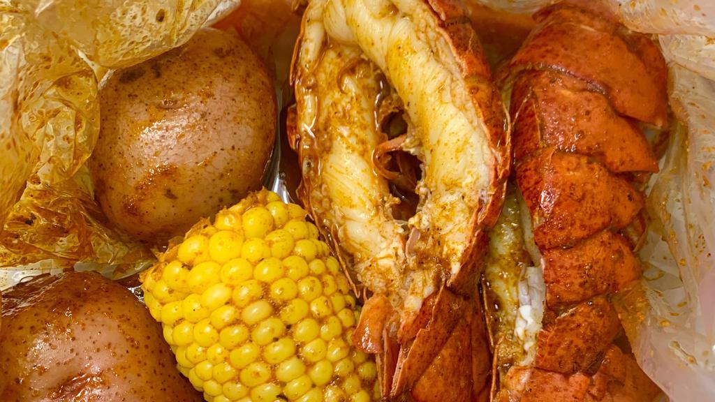 Twin Lobster Tail 🦞🦞 · Two lobster tails well prepared, comes with 1 corn & 2 potato