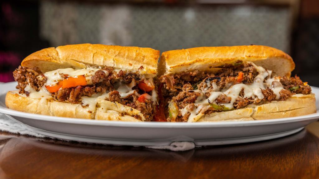 Steak Bomb · Steak, American cheese, green and red bell pepper, white onions, mushrooms and tomato.