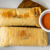 Tamales · Corn flour tamales with veggies and chicken.
