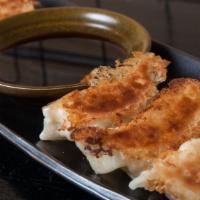 Chicken Gyoza · House made Japanese style chicken dumpling with soy vinegar dipping sauce.