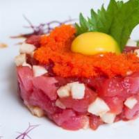 Tuna Tartare · With sesame seeds, chives, and quail egg.