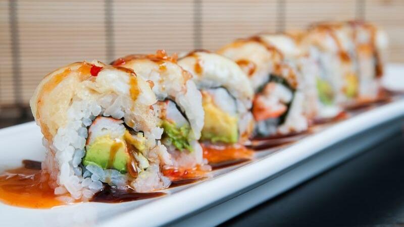 Fantasy Roll · Eel, shrimp, avocado, and crab stick topped with tempura white fish, eel sauce, and sweet chili sauce.