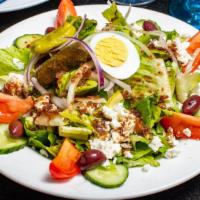 Greek Salad · Fresh Romaine, tomato, scallions, olives, cucumbers, onions, green pepperoncini, and Feta ch...