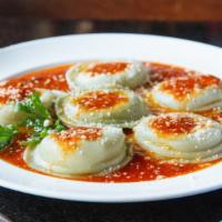 Ravioli Verdi · Cheese and spinach stuffed ravioli, topped with our home made tomato sauce.