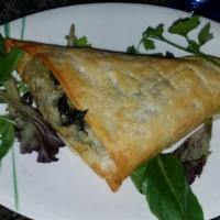 Spanakopita · Fresh spinach, parsley, dill, scallions, and Feta cheese, baked in buttered filo.