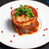 Moussaka · Sautéed eggplant, layered with selected cheeses, sliced zucchini, and baked in a bechamel sa...
