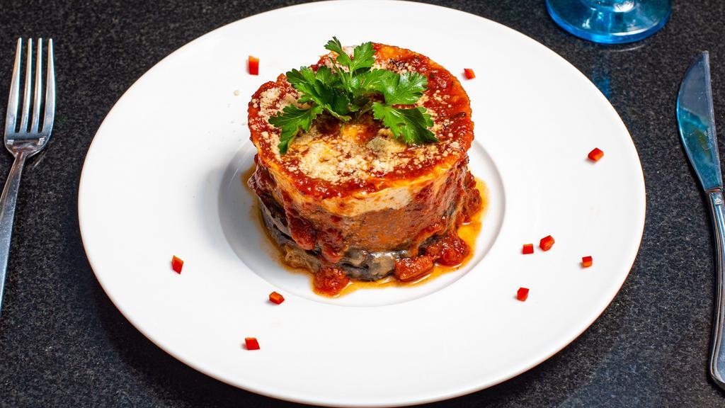 Moussaka · Sautéed eggplant, layered with selected cheeses, sliced zucchini, and baked in a bechamel sauce.