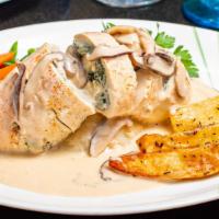 Chicken Lefkadas · Chicken breast stuffed with fresh spinach and feta cheese, served with mushroom cream sauce ...