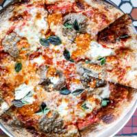 Tripper Pizza · tomato, beef meatballs, ricotta, Sicilian hot sauce, and fresh oregano.