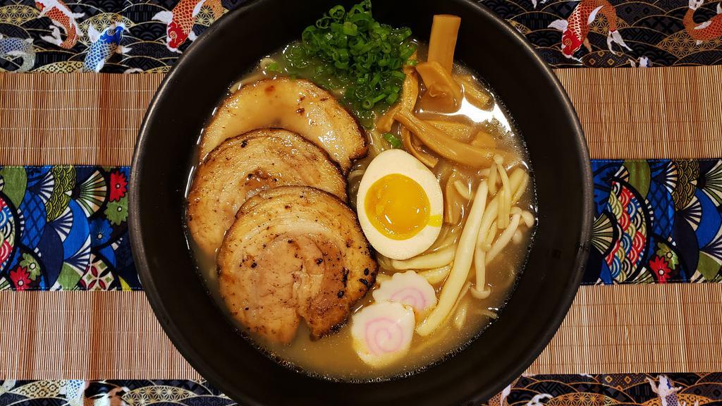 Shoyu Ramen · Topping :
Bamboo Shoots, Chopped Scallion, Mushroom, Naruto & Seasoned Boiled Egg (1/2).
Soup (12oz) :
Light Soy Sauce & Chicken Broth.