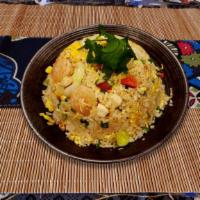 Stir-Fried Rice · Come with cabbage, chopped scallion, cilantro, corn, onions, and scrambled egg.
