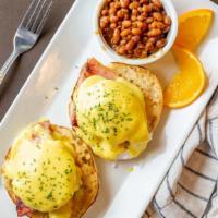 Shaved Steak Benny · English muffins topped with eggs, shaved steak, and Hollandaise with side of home fries or b...