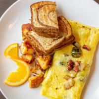 Western Omelette · Onions, peppers, ham and cheese. Made with 3 eggs. Includes toast and your choice of side.