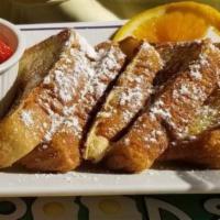 French Toast · Texas style with powdered sugar and butter.