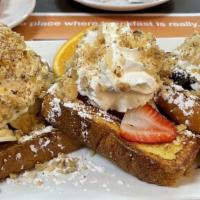 French Riviera · 3 pieces of French Toast overstuffed to the max with strawberries, bananas, blueberries, top...