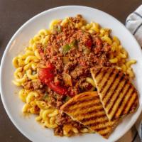 American Chop Suey · Elbow pasta, sautéed hamburger with peppers and onions, all cooked in a delicious red sauce.