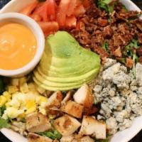Cobb · With chicken, mixed greens, tomatoes, crispy bacon, avocado, hard-boiled egg, blue cheese, F...